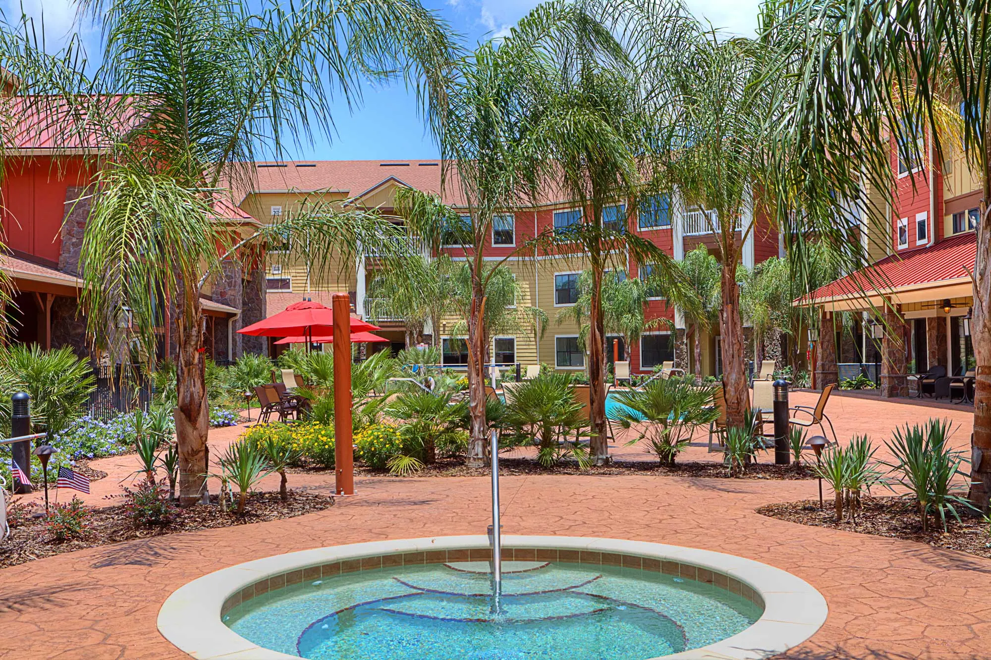 A hot tub surrounded by palm trees in a retirement home in the Villages in Florida