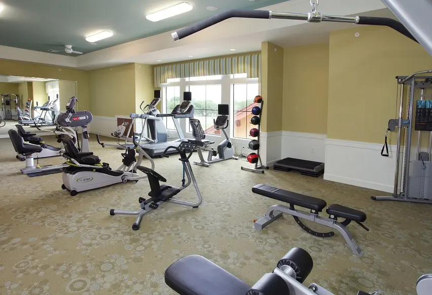 Exercise room with modern equipment in an assisted living facility in Wildwood, FL