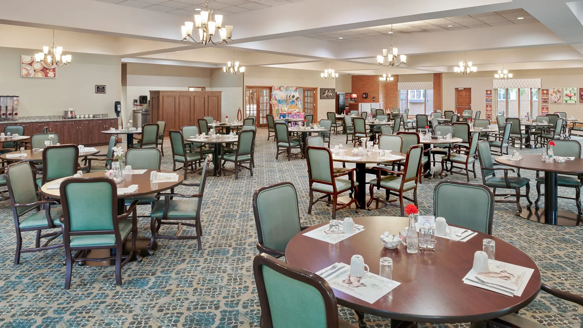 Large carpeted dining hall at American House East I, a senior living community in Roseville, Michigan