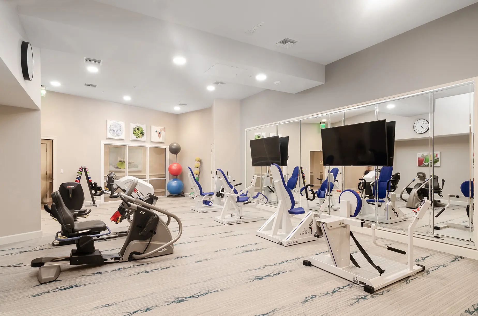 Fitness center at American House Fort Myers retirement community