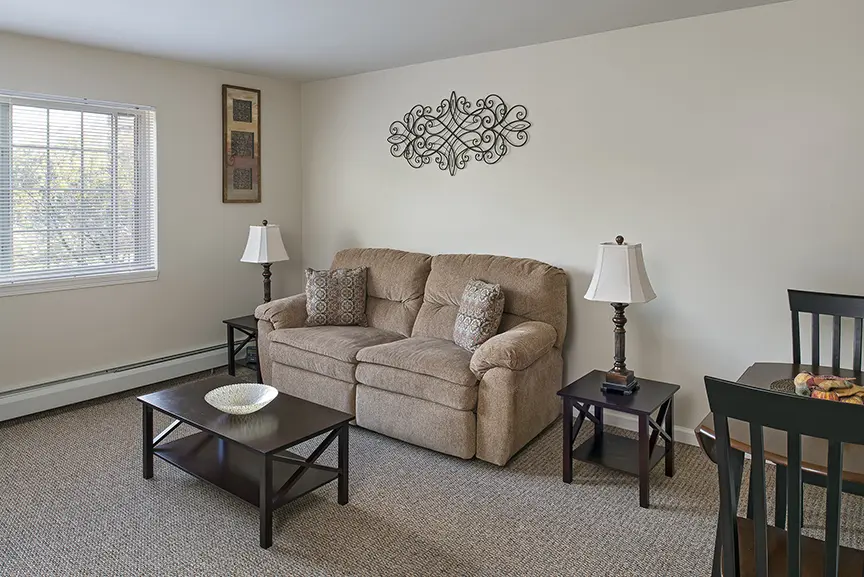 Living room of a senior apartment at American House Southgate, a retirement home in Southgate, MI