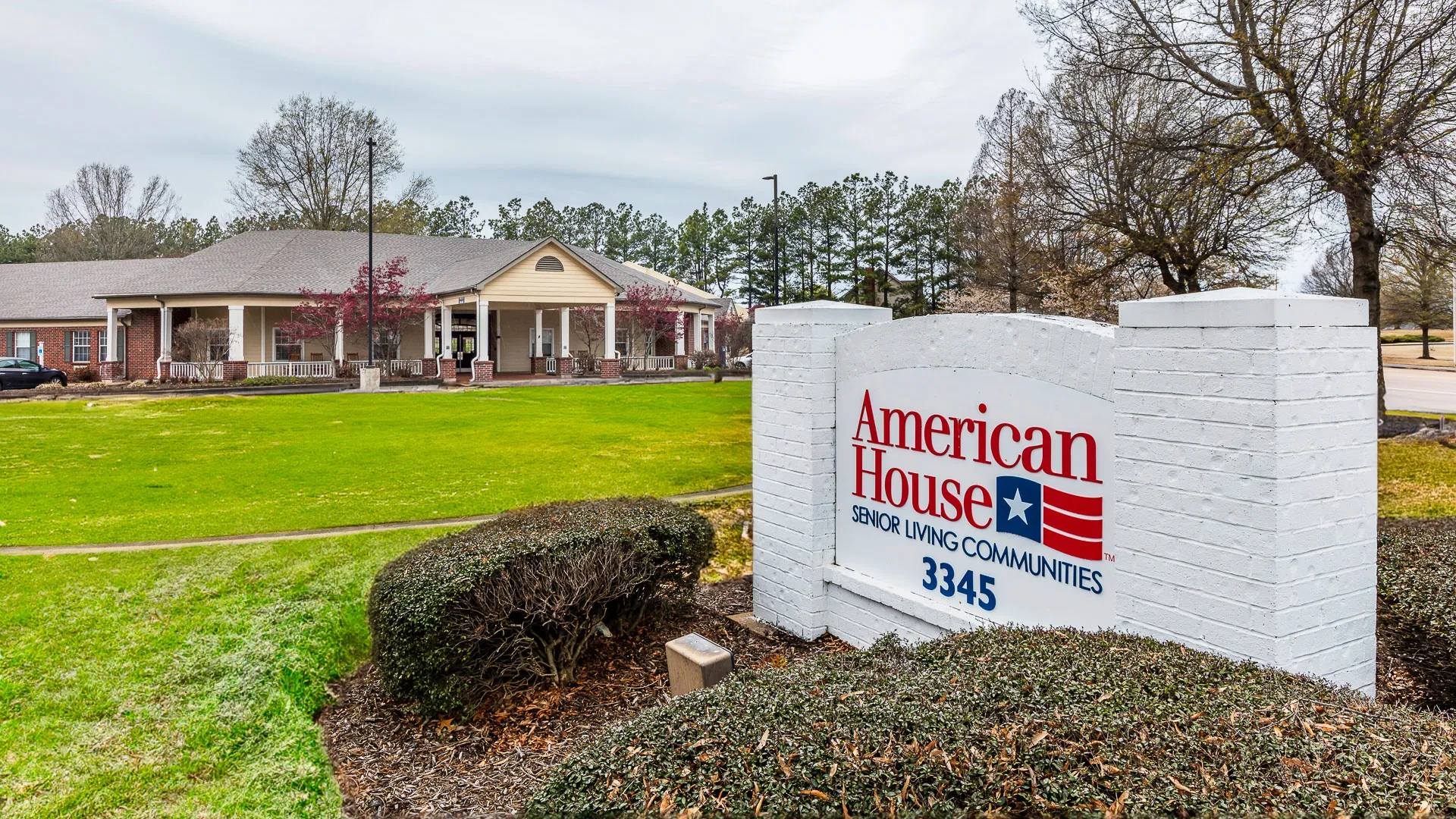 American House Bartlett exterior view with address sign