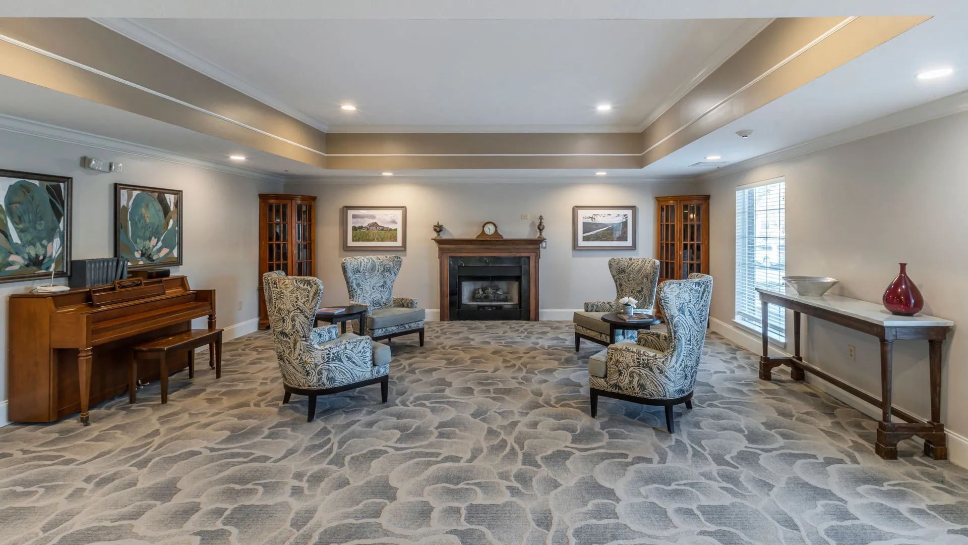 Cozy piano lounge at American House in Chattanooga assisted living and memory care facility