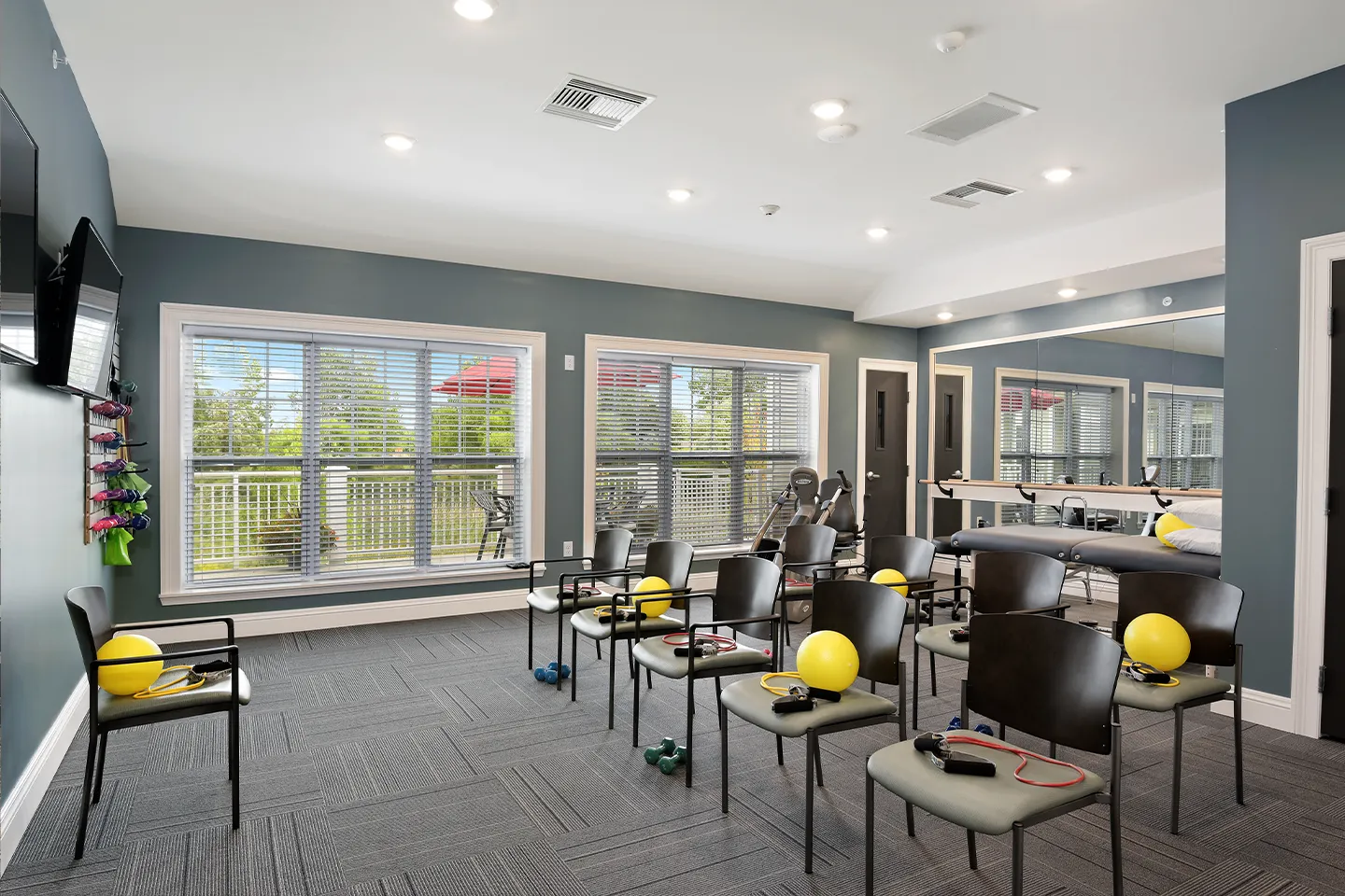 Accessible fitness room at American House Hampton Village senior living facility in Rochester Hills