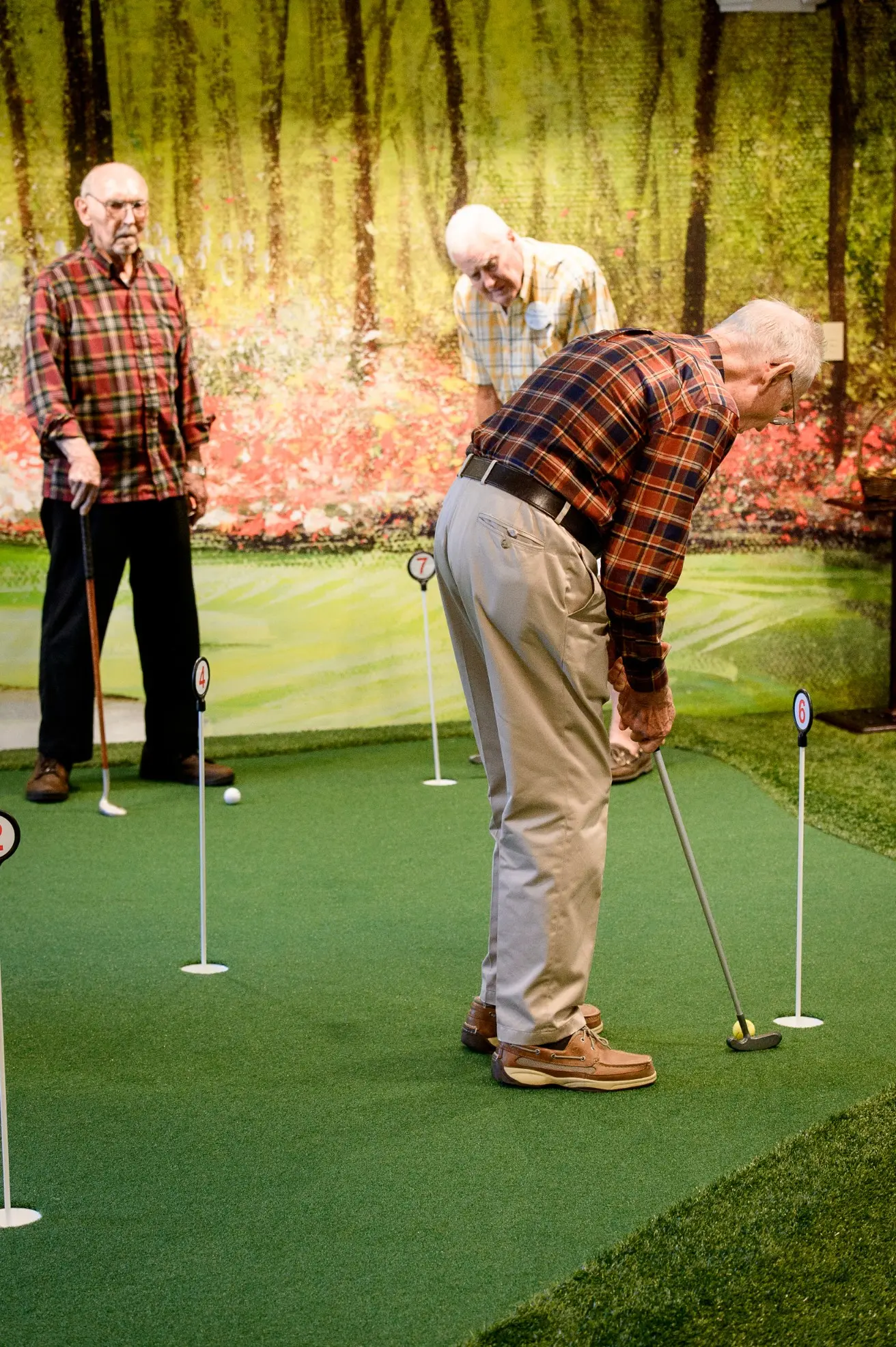 Seniors golfing at a senior living community in Niceville, FL