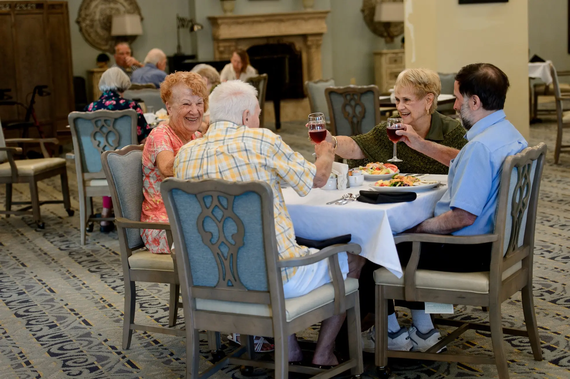 Seniors sitting at the dining area of a senior living community in Niceville, FL