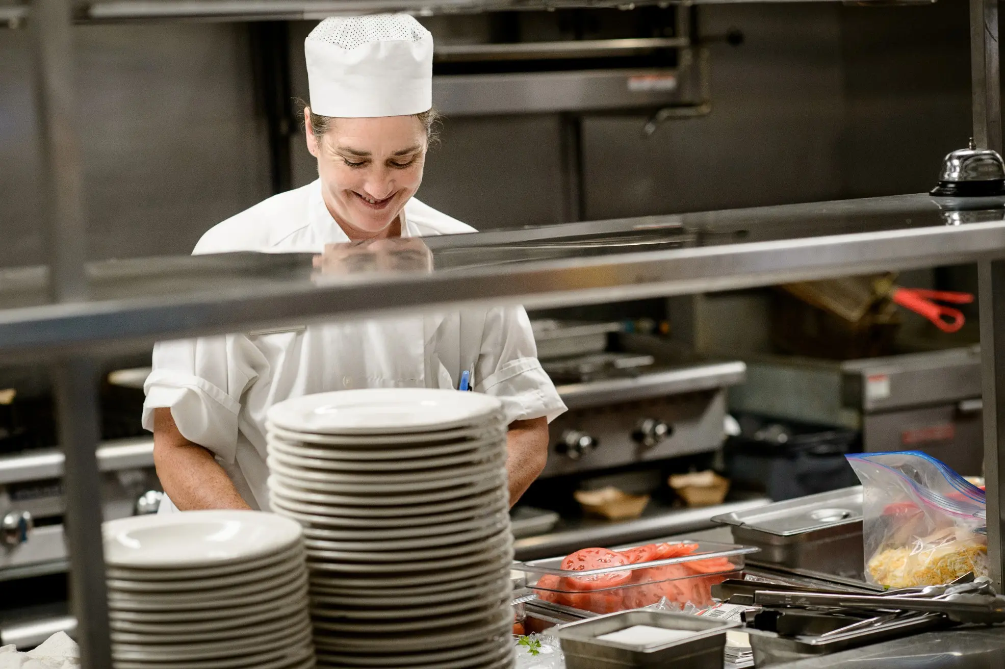 Chef preparing food in the kitchen of a senior living community in Niceville, FL