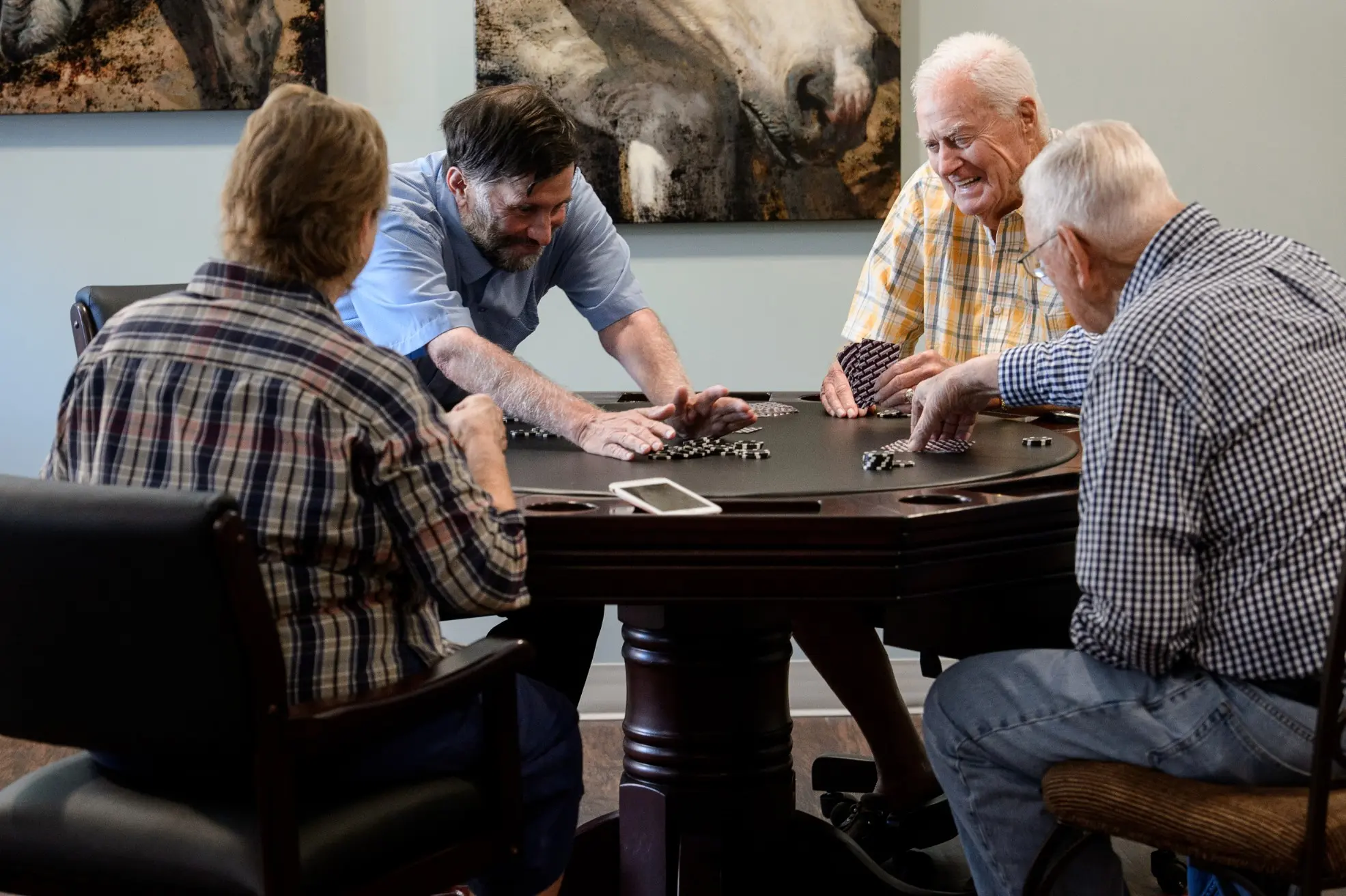 Seniors playing cards in the activity room of a senior living community in Niceville, FL