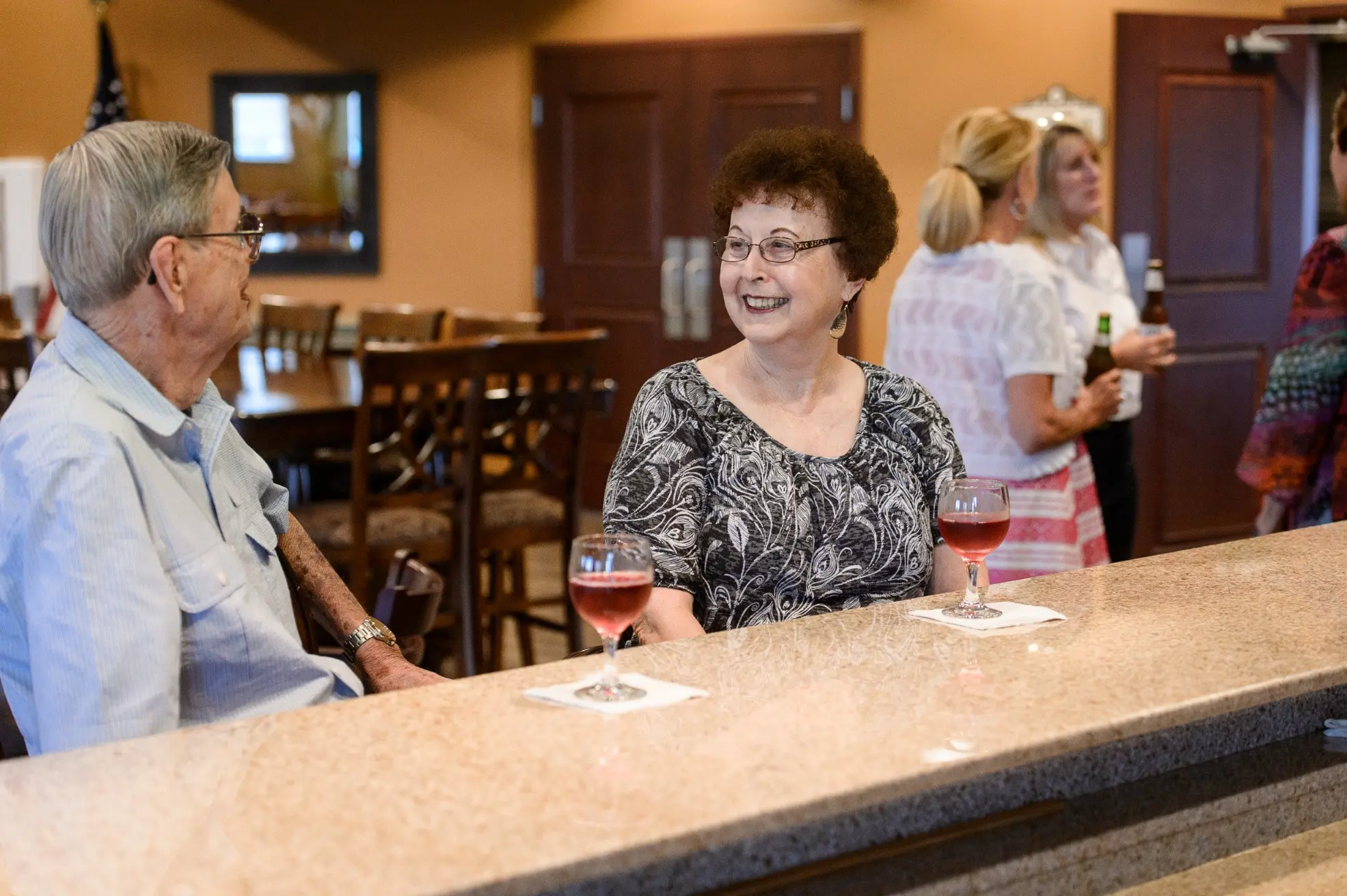 Seniors at the bar / common area of a senior living community in Niceville, FL