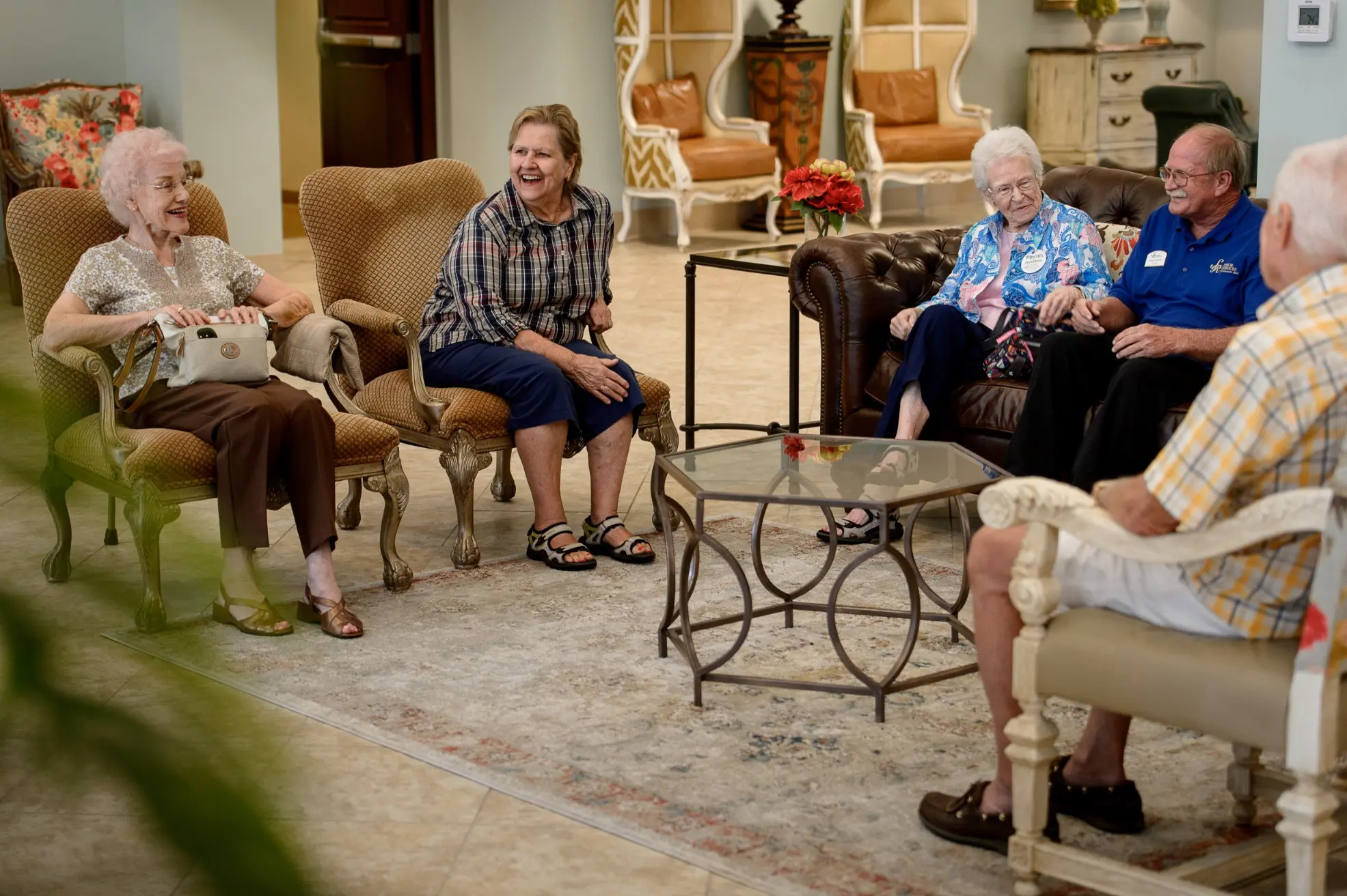 Seniors sitting at a common area of a senior living community in Niceville, FL