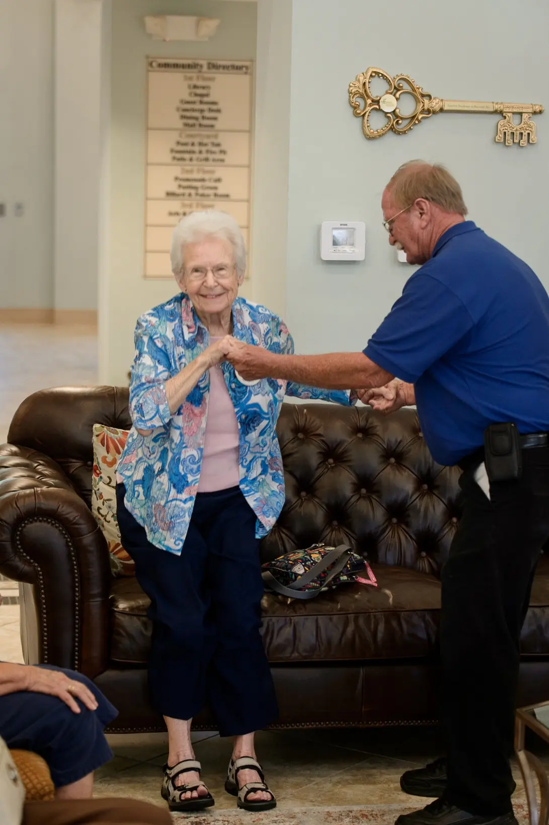 Seniors dancing in the common area of a senior living community in Niceville, FL
