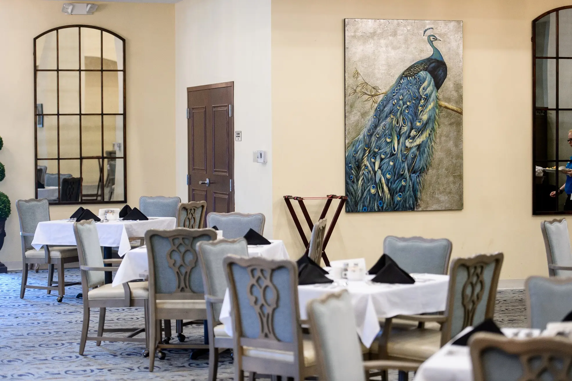 Carpeted dining area of a senior living community in Niceville, FL