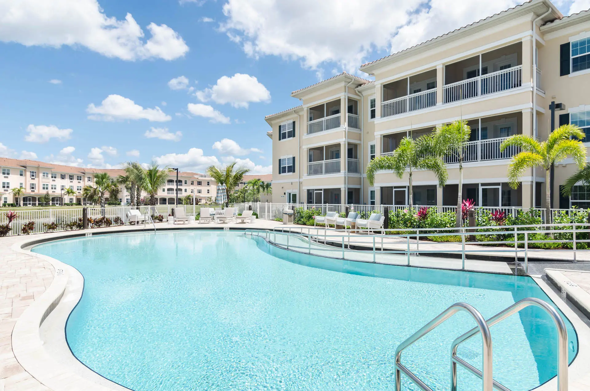 Exterior shot of a pool at American House Bonita Springs III, a senior living community in Bonita Springs, FL