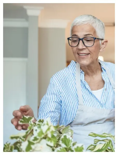 American House Carpenter independent and assisted living resident caring for plant