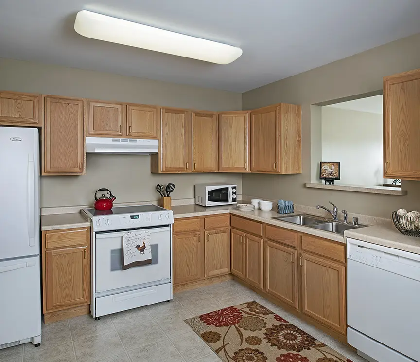 Kitchenette of a senior apartment at American House Cedarlake, a senior living community in Plainfield, Illinois