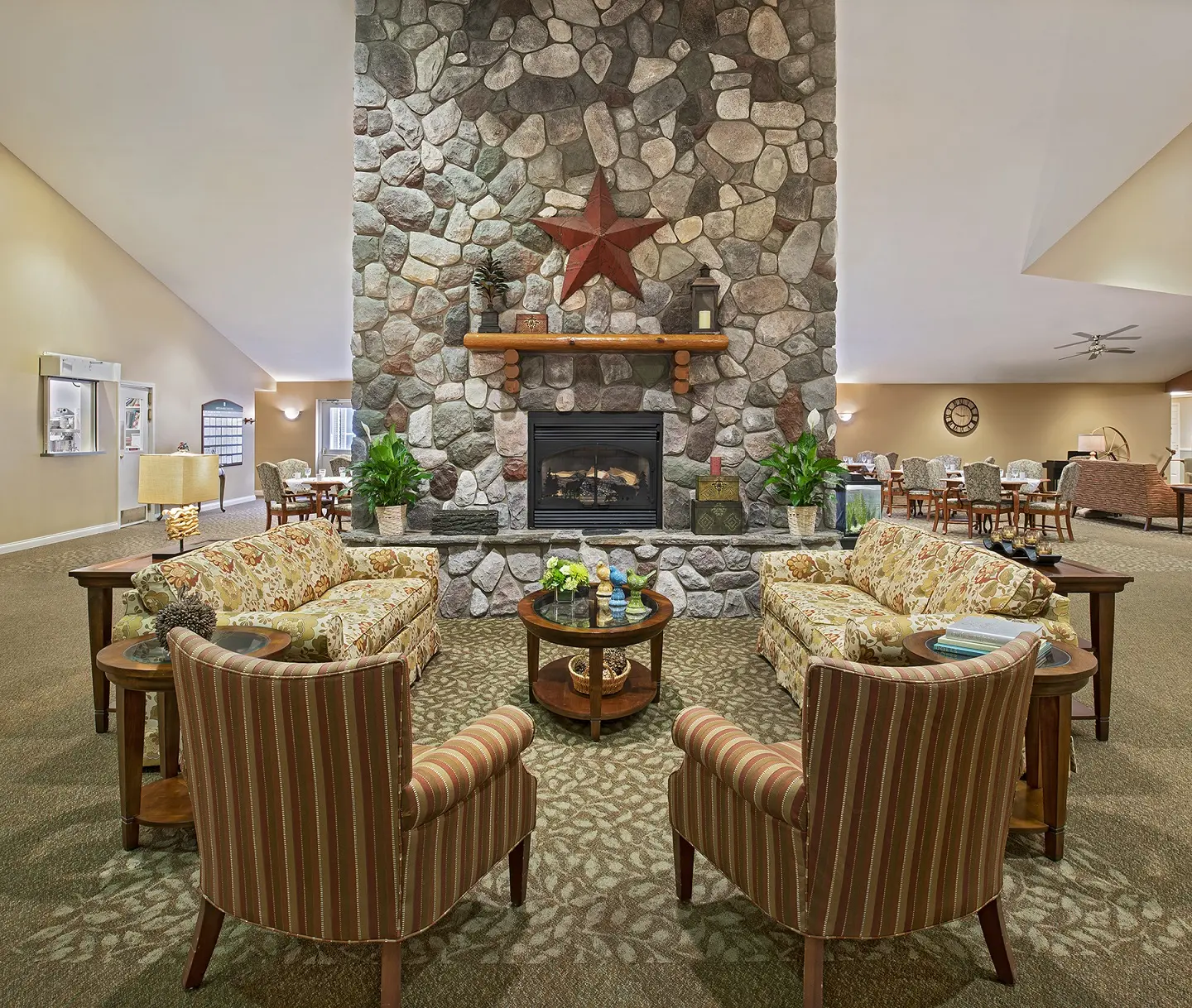 Fireplace / common area of American House Charlevoix, a senior living community in Charlevoix, Michigan