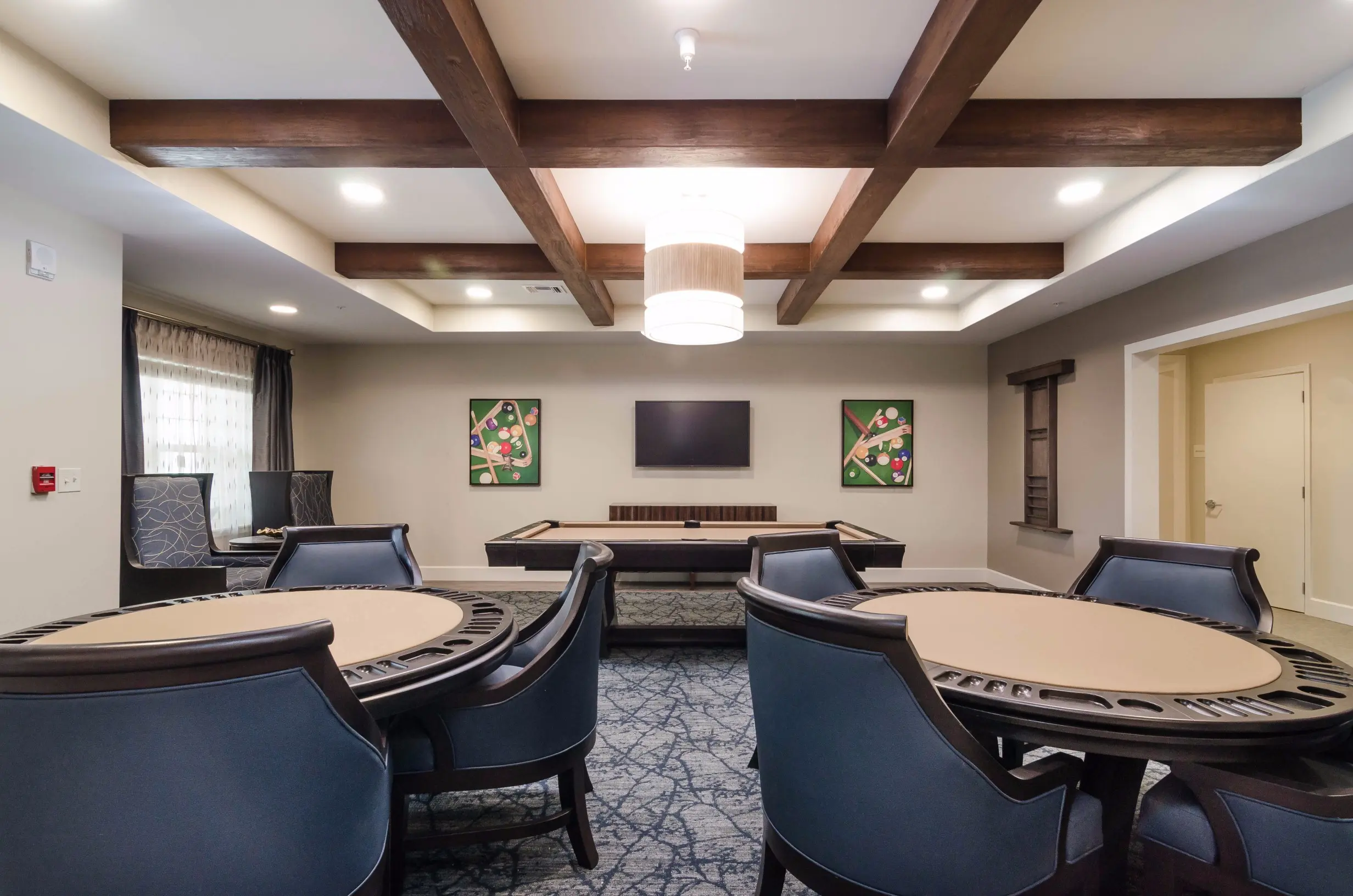 Game / common area at American House Coconut Point, a retirement community in Estero, FL