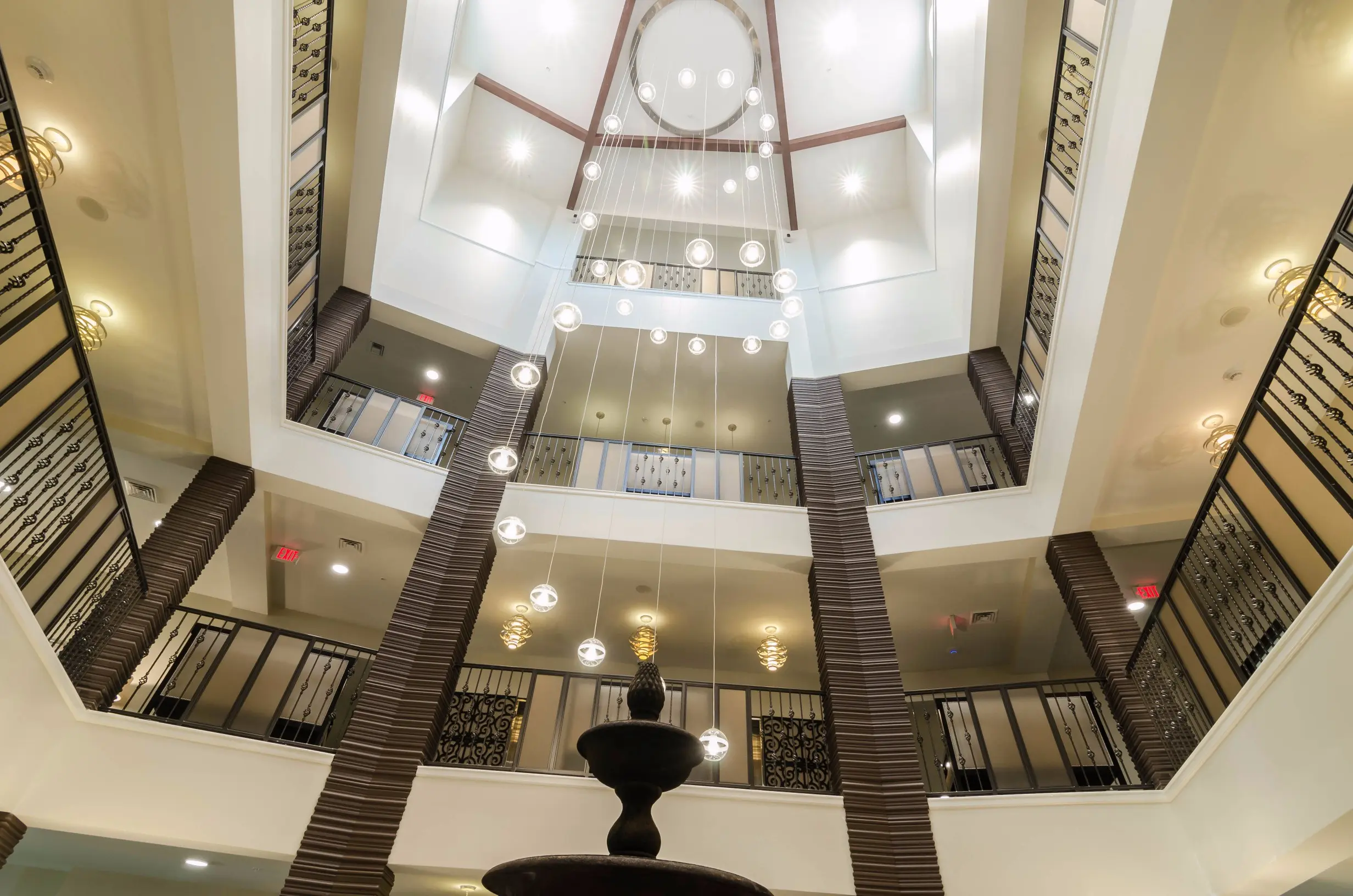 Tiered view of Lobby / fountain at American House Coconut Point, a senior living community in Estero, FL