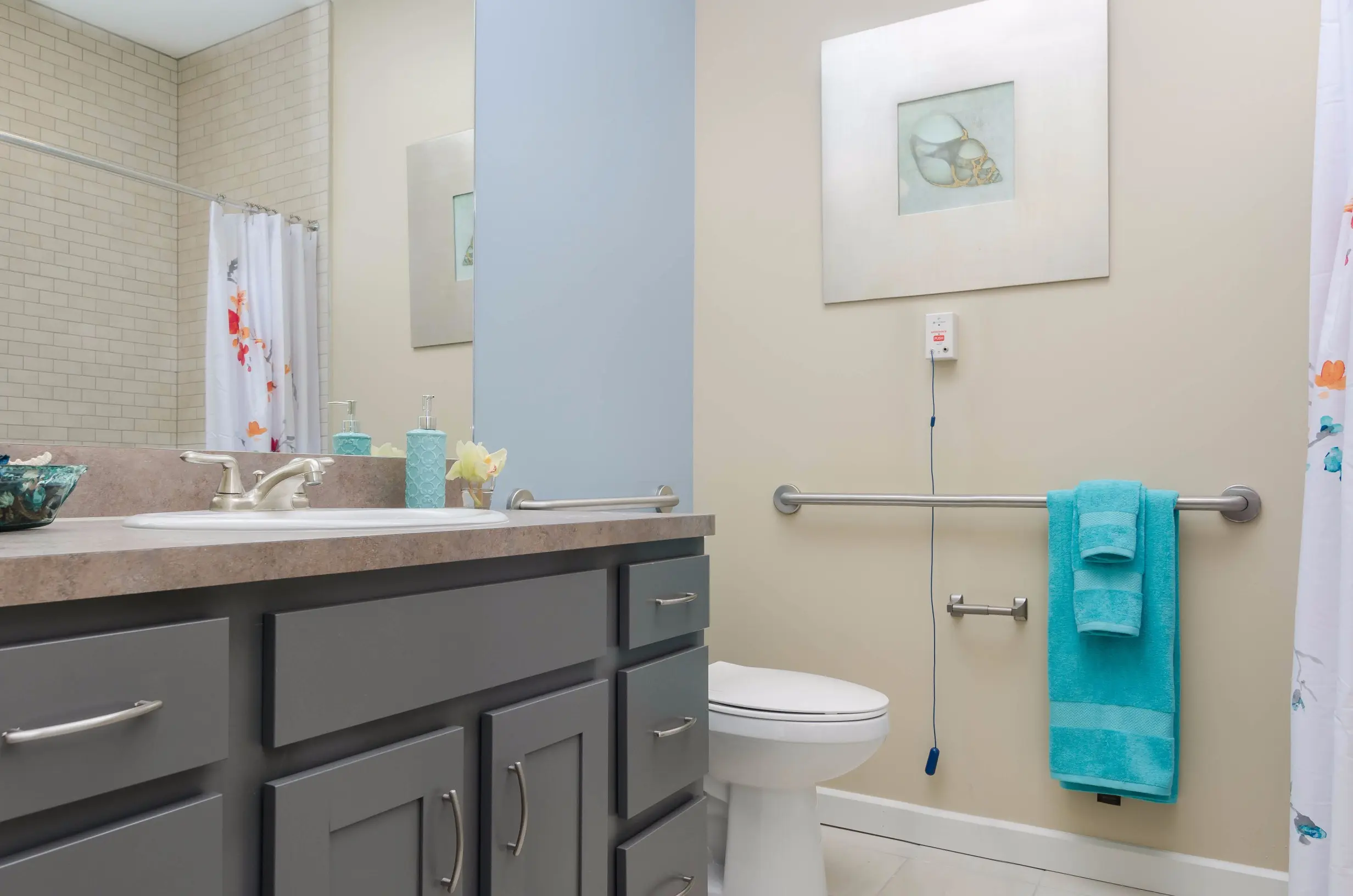 Bathroom of a senior apartment at American House Coconut Point, a senior living community in Estero, FL