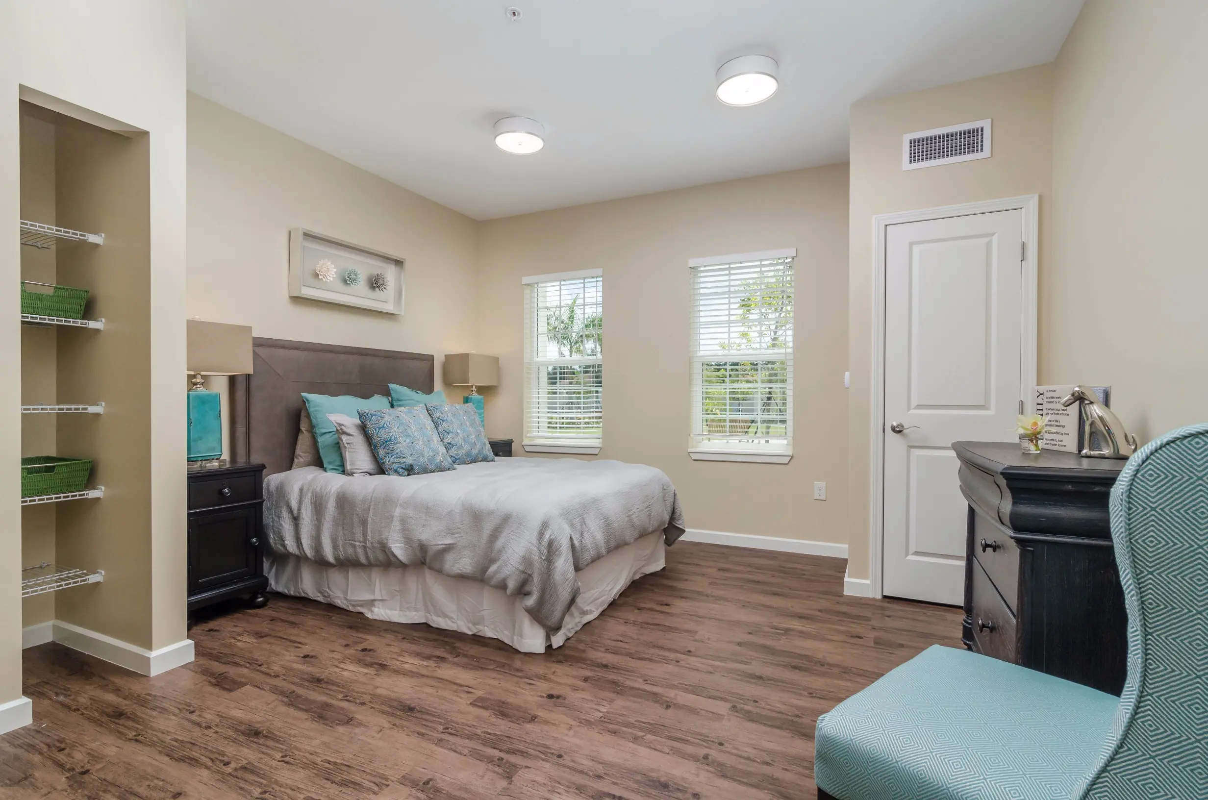 Bedroom of a senior apartment at American House Coconut Point, a senior living community in Estero, FL