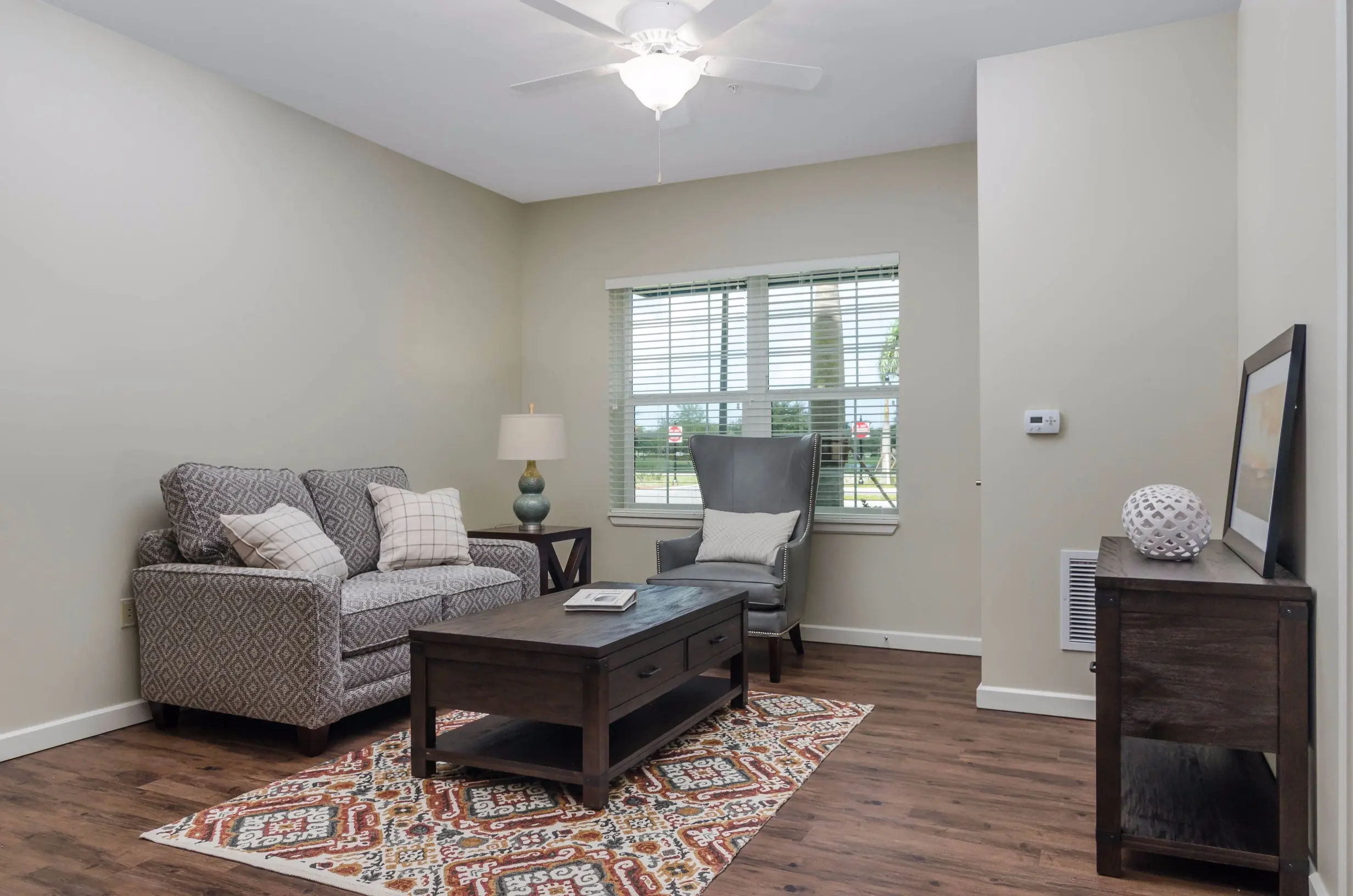 Family room of a senior apartment at American House Coconut Point, a senior living community in Estero, FL