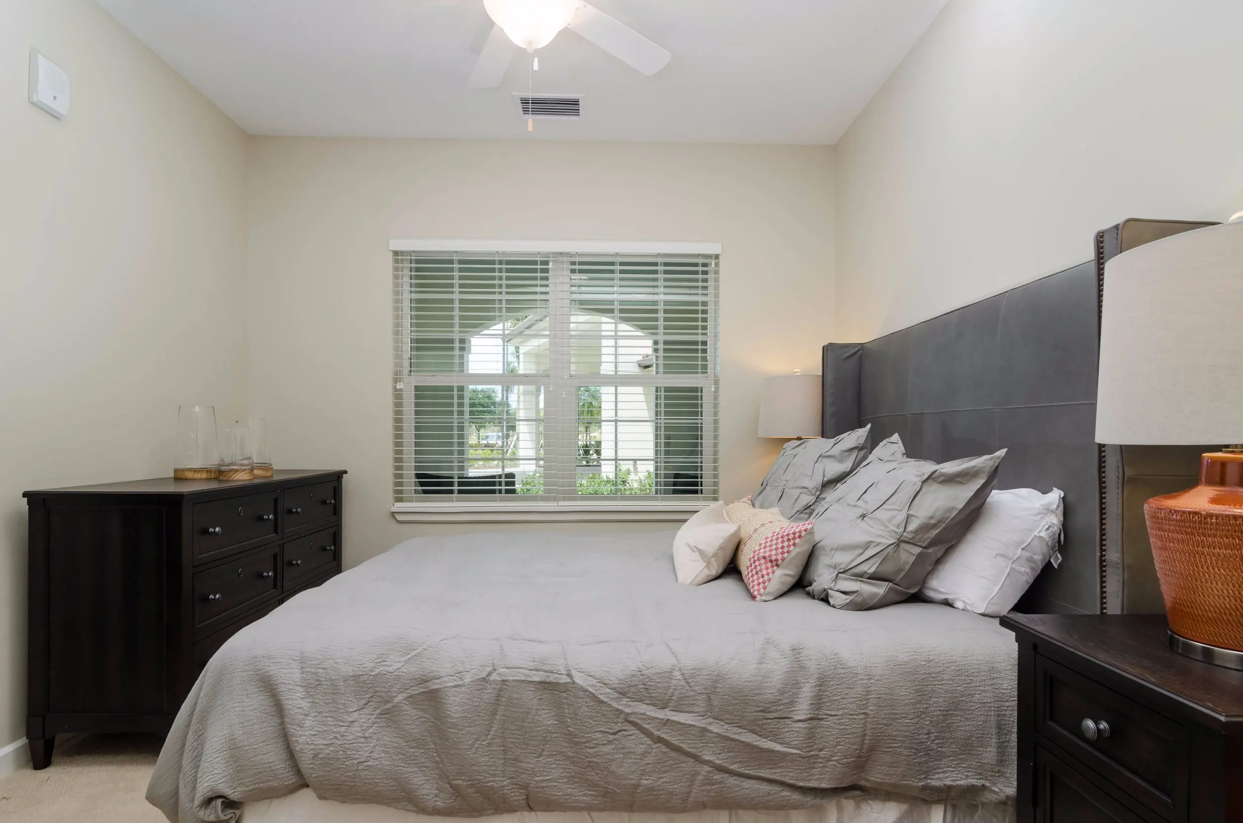 Bedroom of a senior apartment at American House Coconut Point, a retirement community in Estero, FL