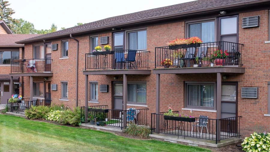 Exterior shot with balconies of American House East II, a retirement community in Roseville, Michigan