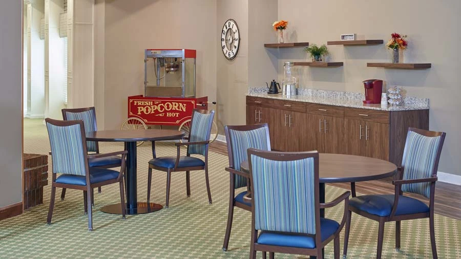 Carpeted common area at American House East II, a senior living community in Roseville, Michigan