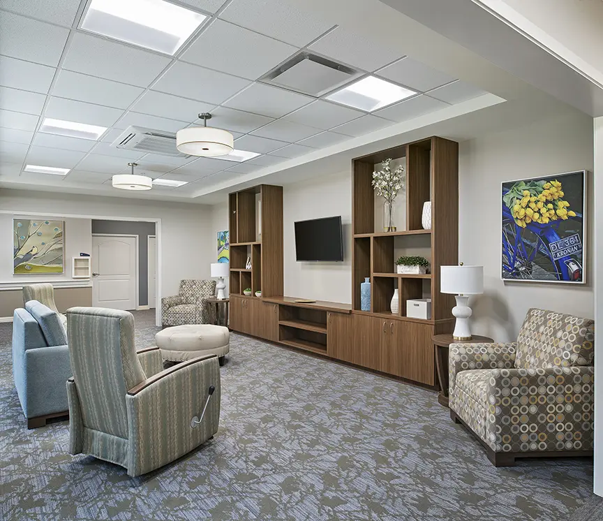 Carpeted lobby / common area of American House Freedom Place Rochester, a memory care community in Rochester, Michigan