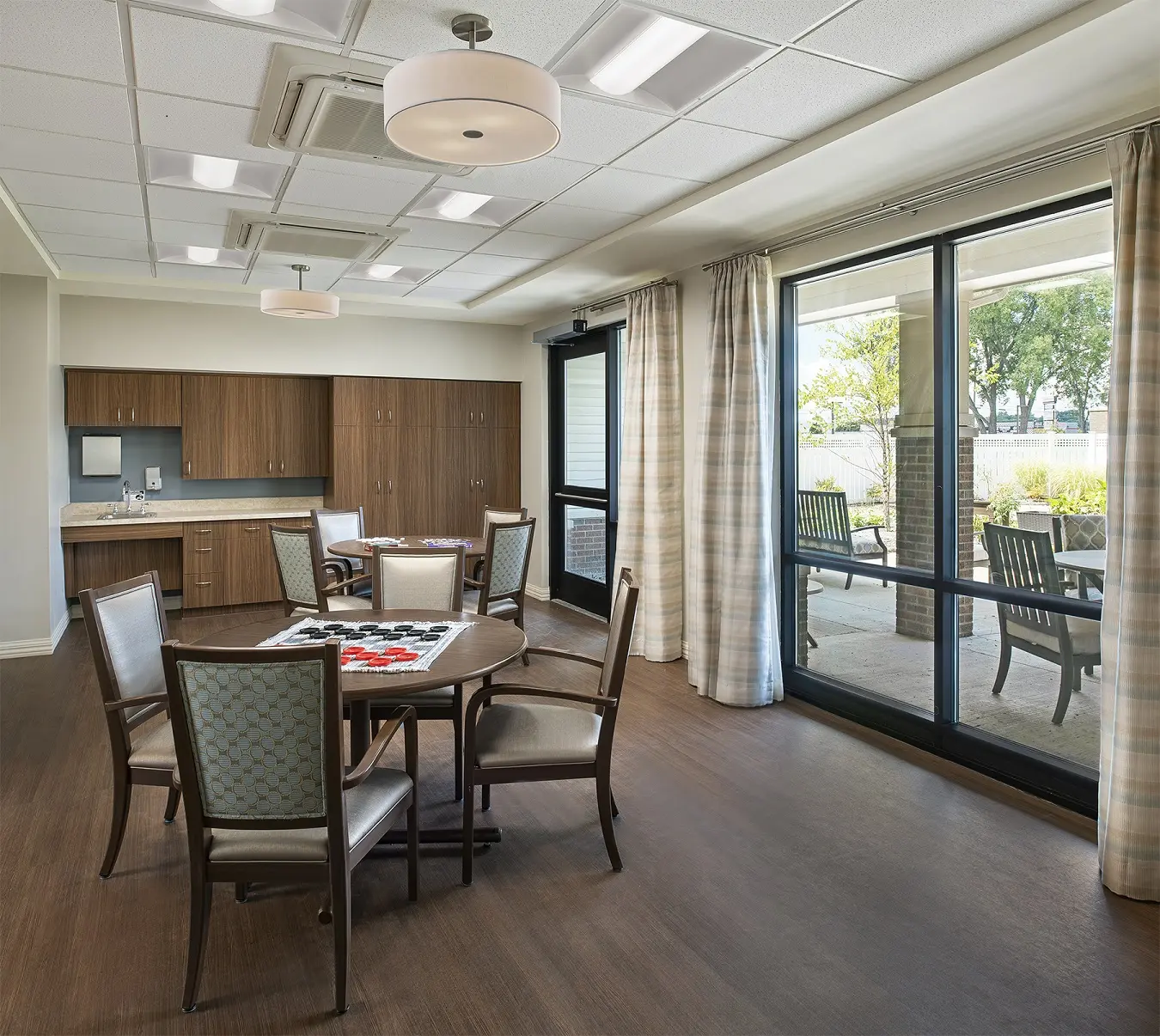 Activity / game room area at American House Freedom Place Roseville, a memory care community in Roseville, Michigan