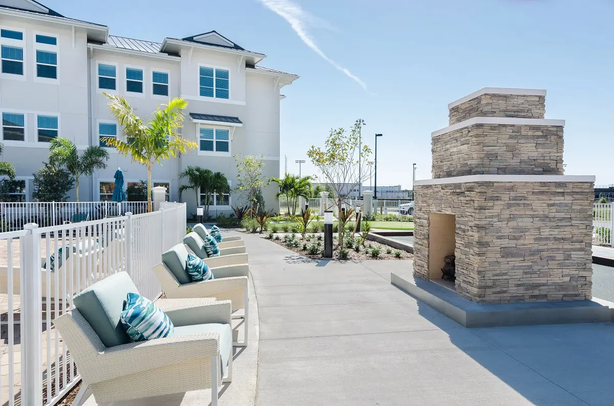 Patio with fireplace at American House Ft. Myers Senior Living Community