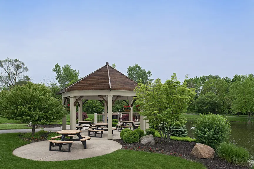 Outdoor patio by the water at American House Jenison