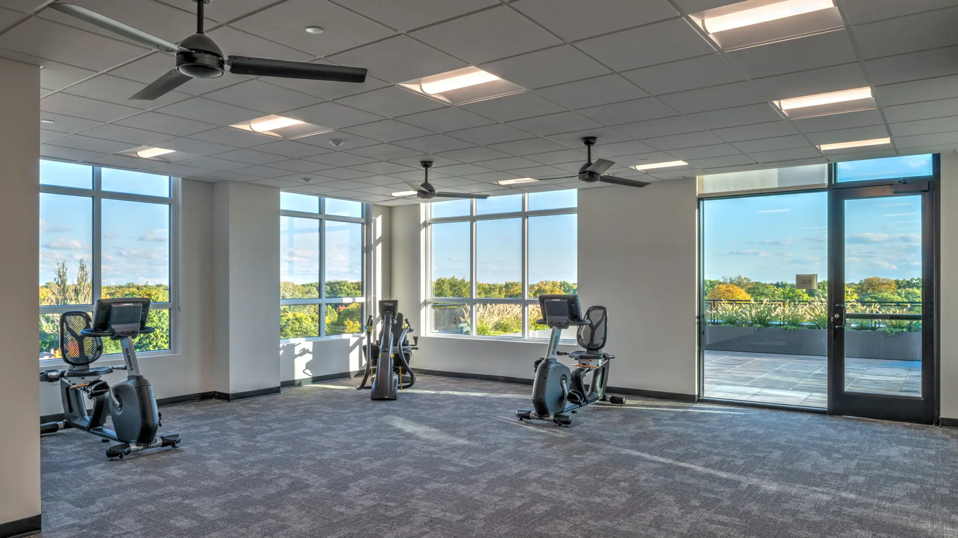 Top floor fitness center at American House Oak Park, a luxury senior living community in Oak Park, Illinois