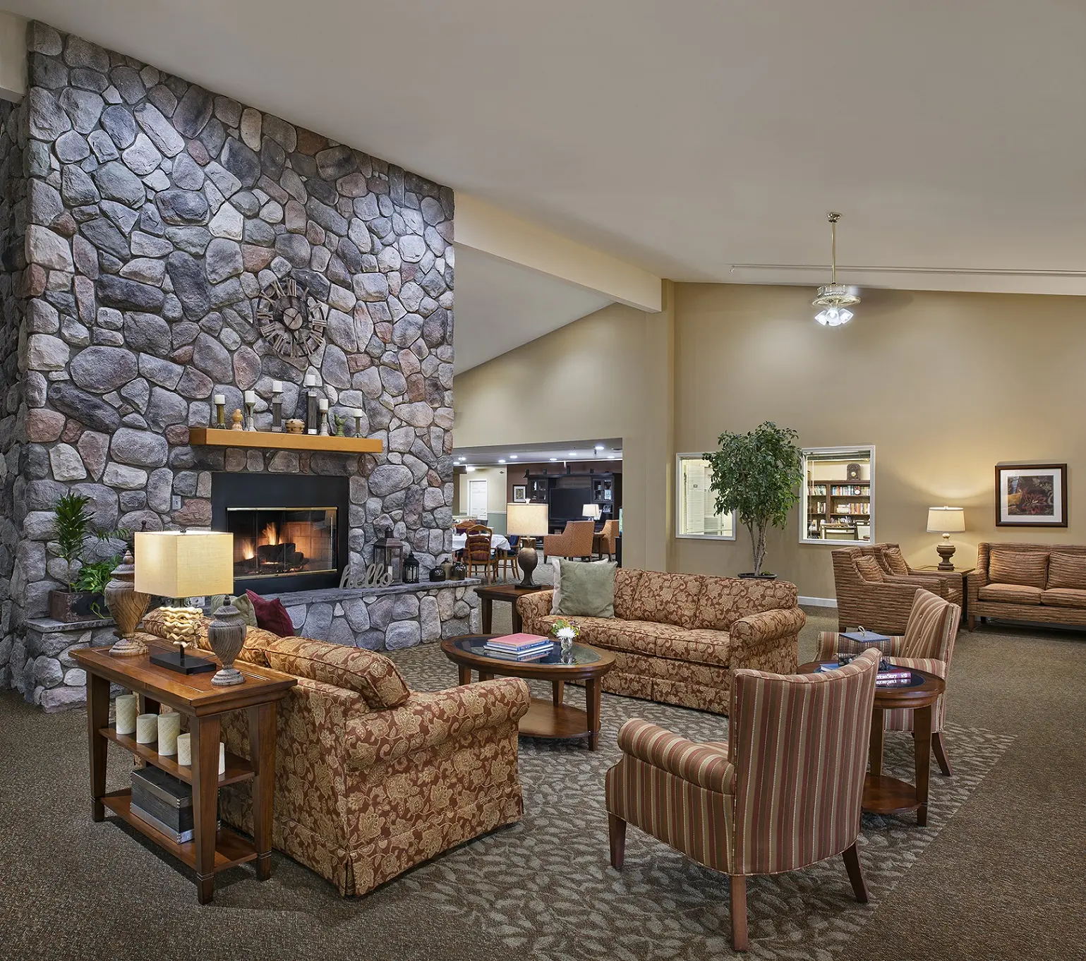 Fireplace lounge at American House Petoskey, a retirement community in Petoskey, Michigan