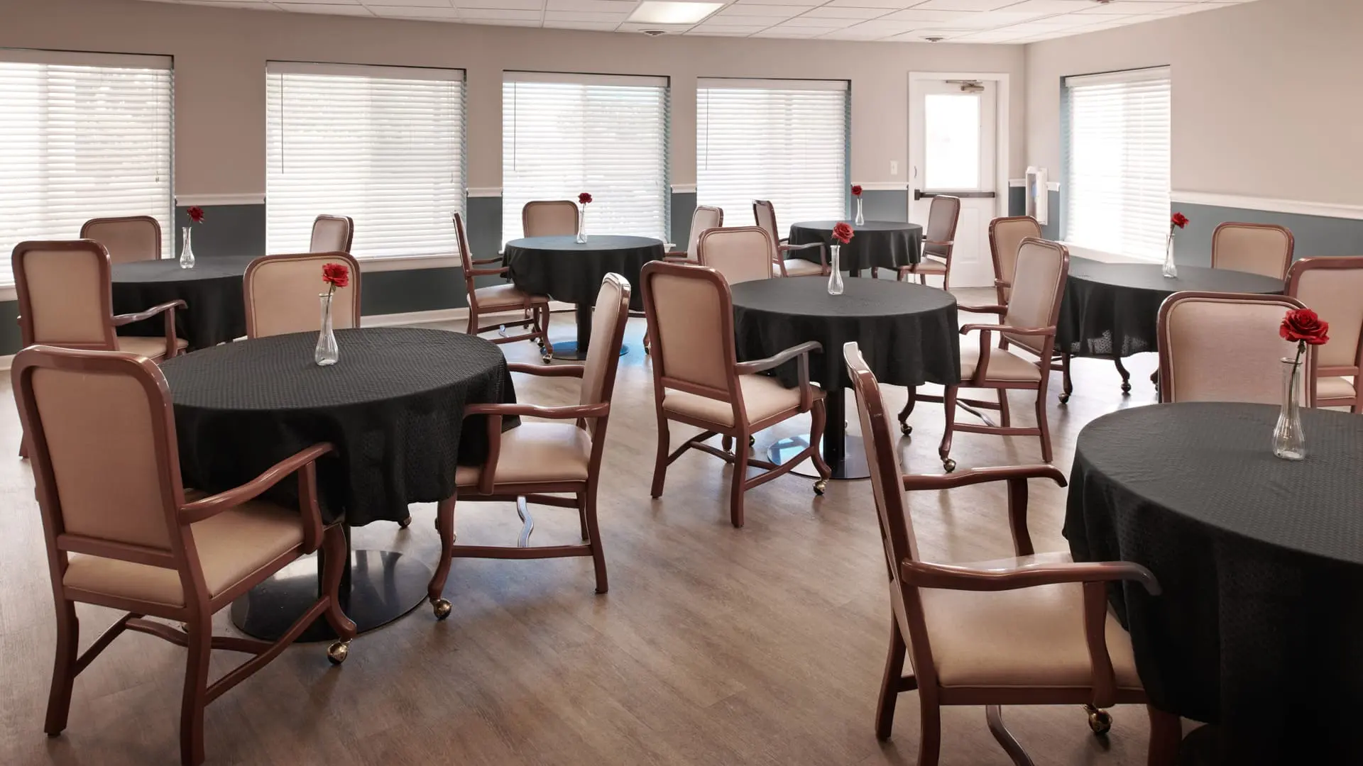 Dining area with roses on tables at elderly home in South Sterling Heights, Michigan