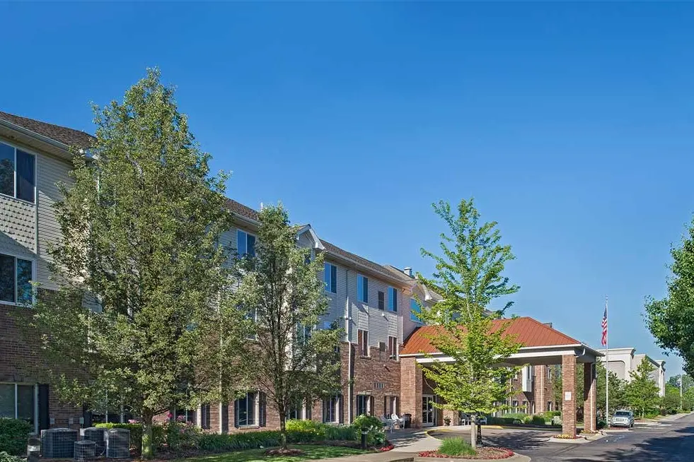 Outdoor entrance and carport at American House Senior Living in North Sterling Heights, MI