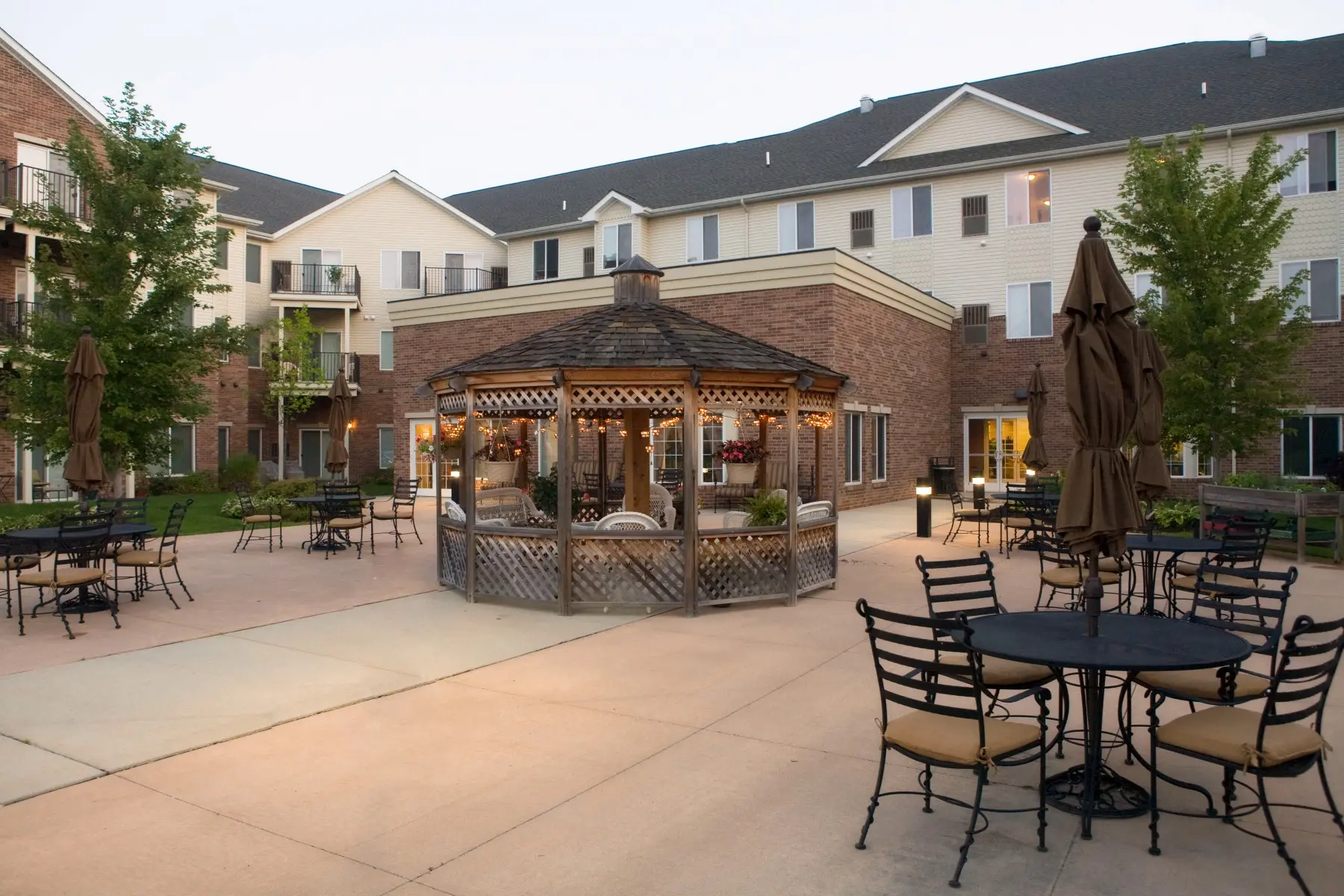 Gazebo and patio at dusk with hanging lights at assisted living facility in Sterling Heights, MI