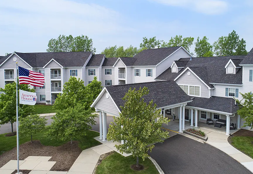 High angle, front exterior shot of American House Senior Living in Troy, MI