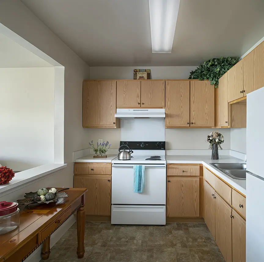 Senior housing kitchen with blue dish towel at retirement home in Troy, MI