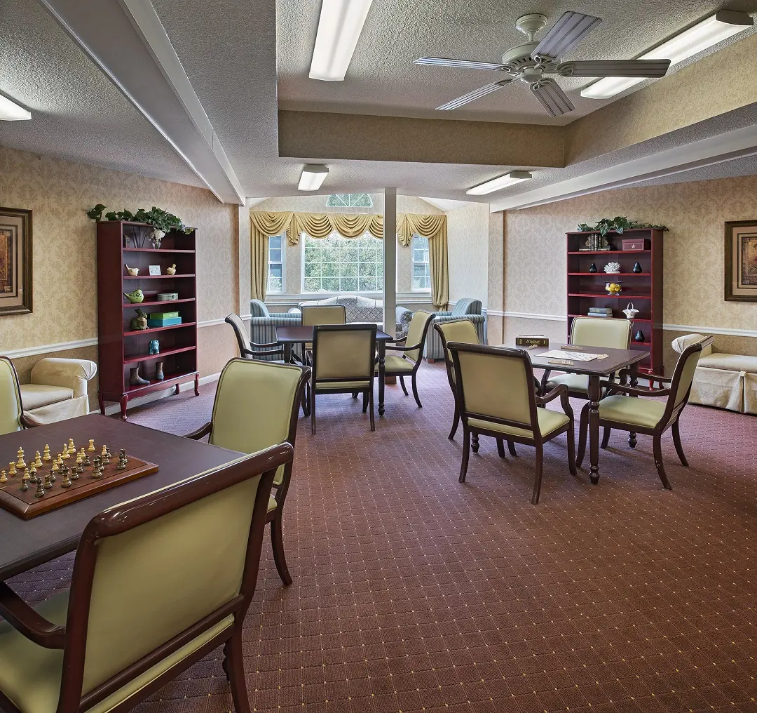 Common area with chess game and word game set up in senior housing in Westland, MI