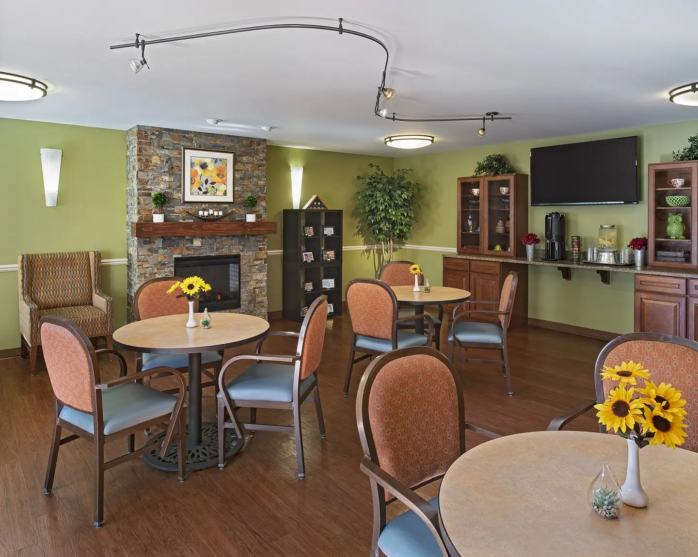 Bistro with fireplace at American House senior living community in Westland, MI