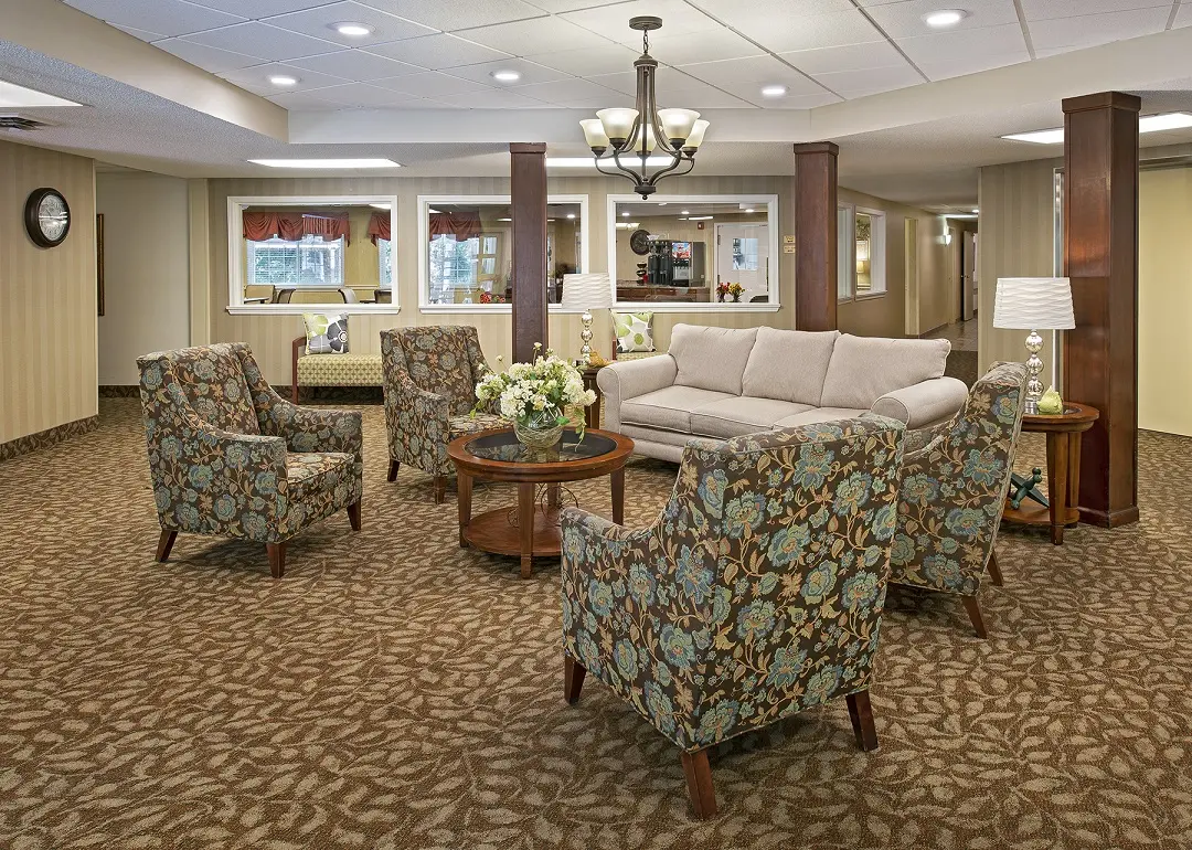 Cozy common area with bistro in the background at senior living community in central Westland, MI