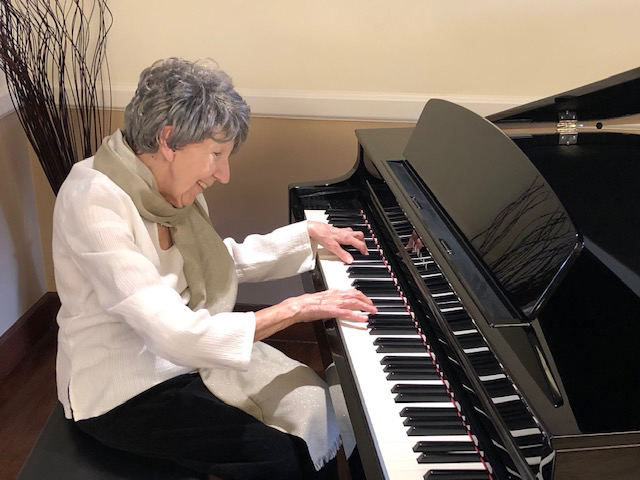 woman playing a piano