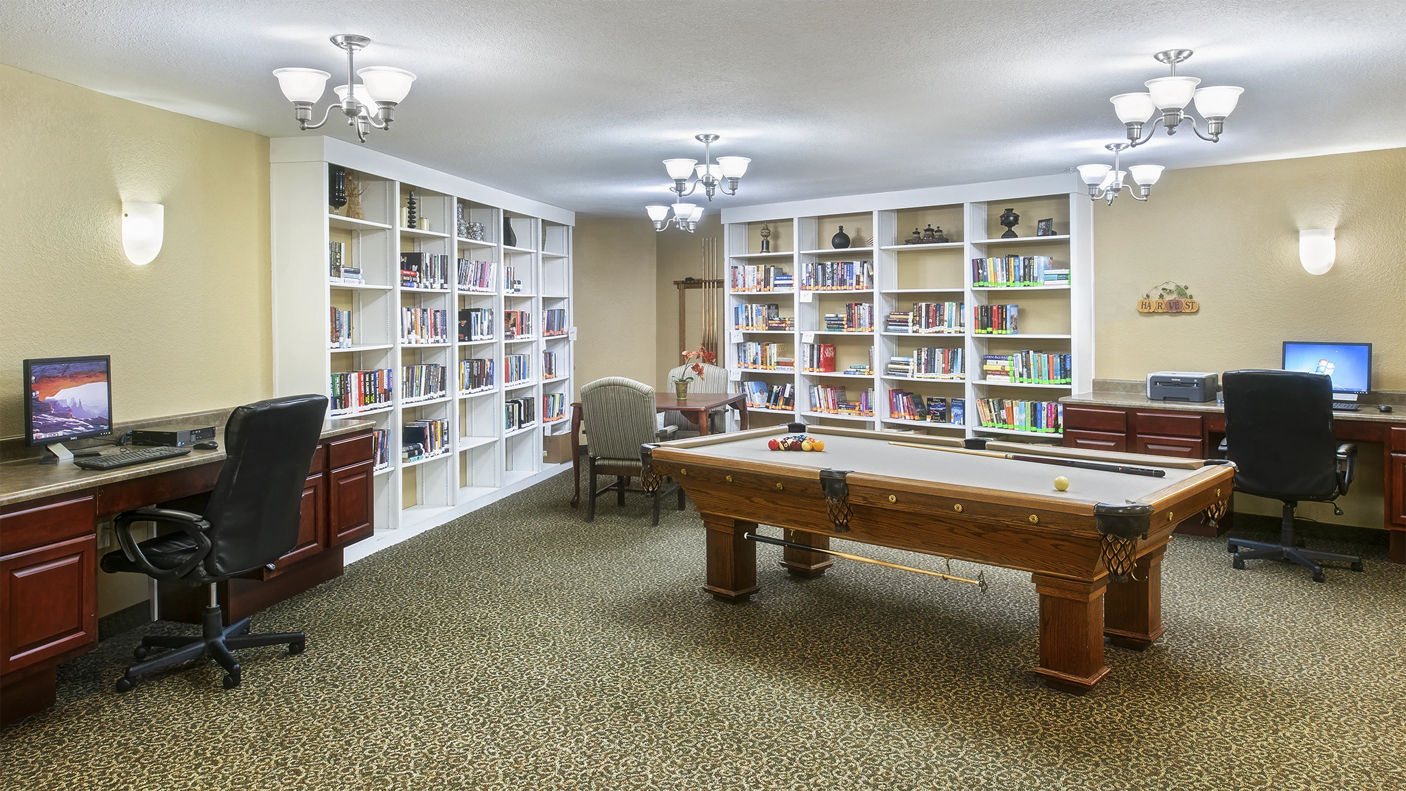 Billiards and game room at American House Milford, a senior community in Oakland County, MI