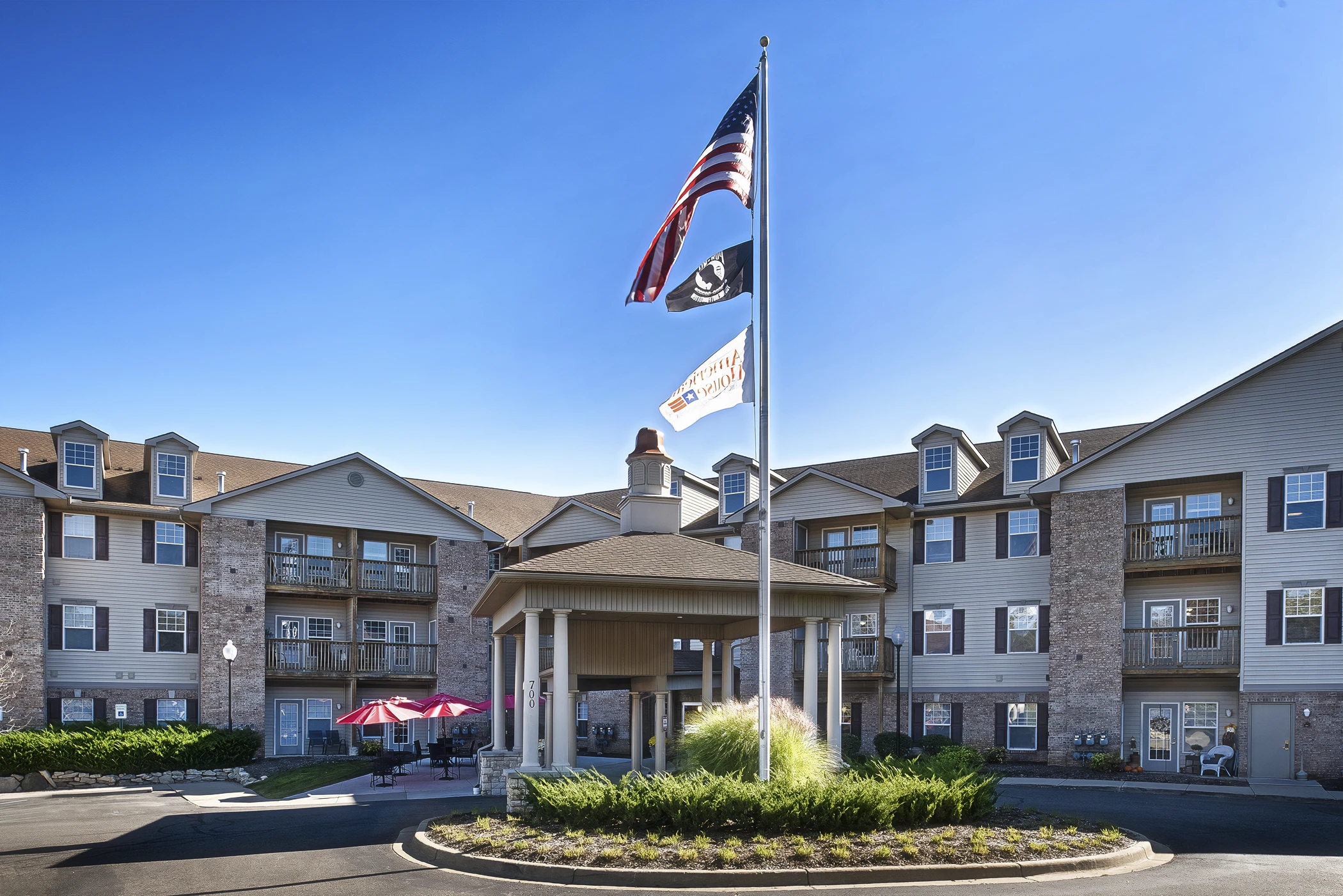 Exterior entrance of American House Milford, a senior living community in Milford, MI